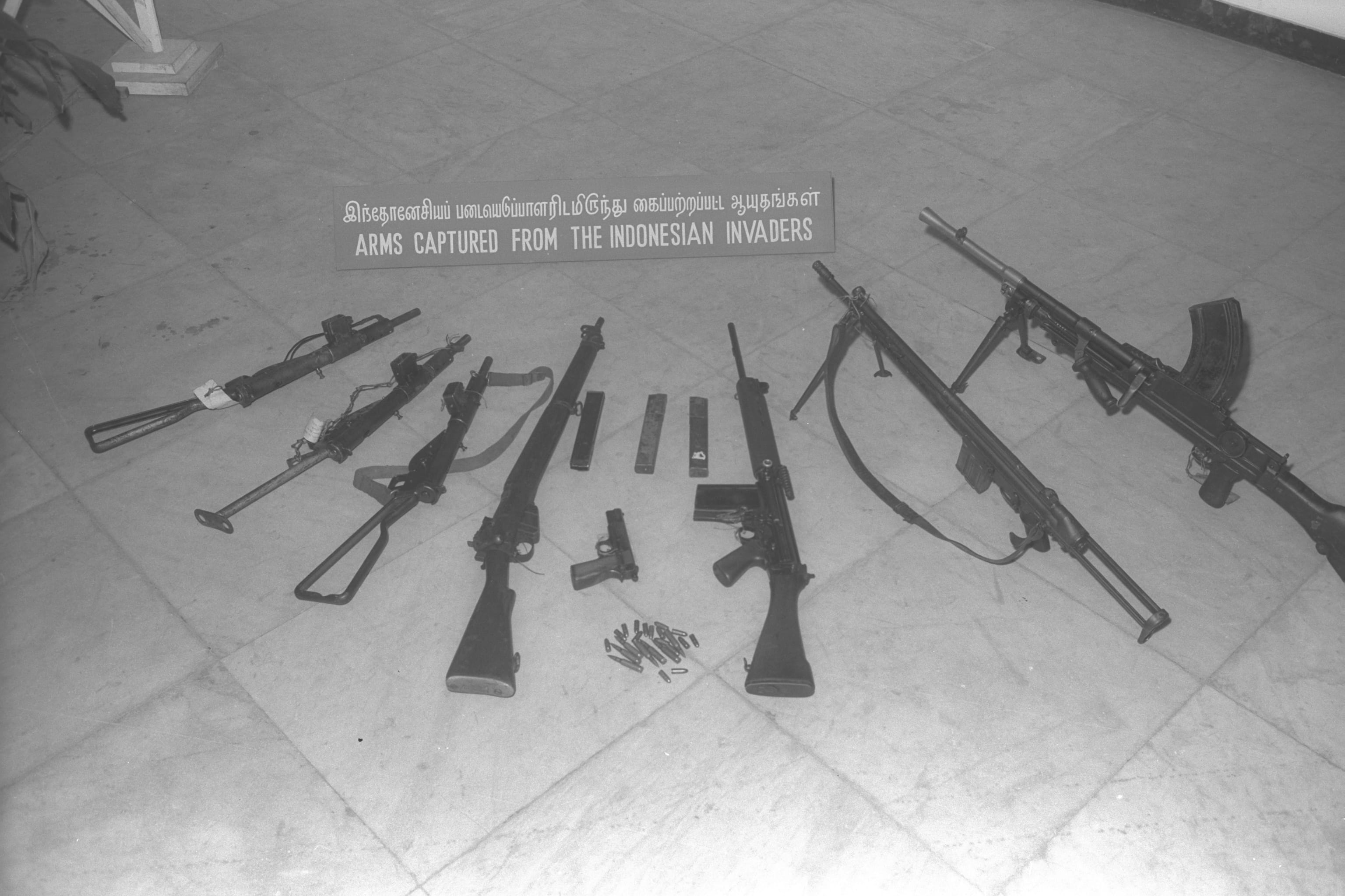 A display of bomb equipment (detonators, fuses and detonating wire) and captured firearms at the "Challenge of Confrontation" exhibition at the Victoria Memorial Hall, 1964. Ministry of Information and the Arts Collection, courtesy of National Archives of Singapore.